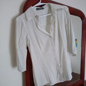 A white polka dot blouse